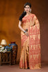 Burning sand ethnic motif hand embroidered silk kutch work saree woman wears peach-colored saree intricate 1