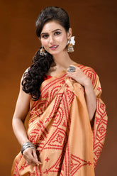 Burning sand ethnic motif hand embroidered silk kutch work saree woman wears peach-colored saree intricate 2