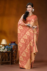 Burning sand ethnic motif hand embroidered silk kutch work saree woman wears peach-colored saree intricate 4