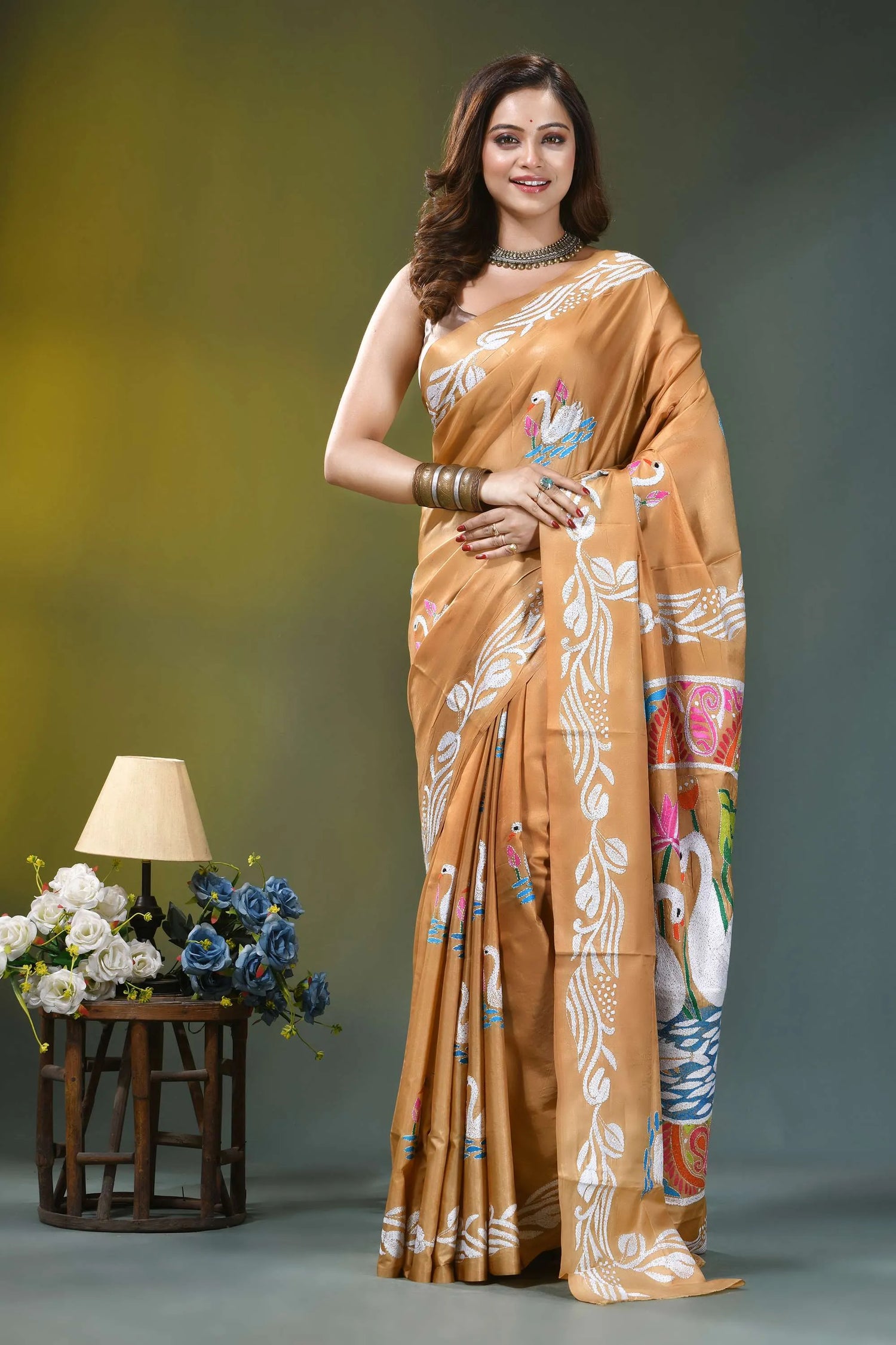 Camel gold multicolor swan design silk kantha saree woman wears golden-orange silk saree 1