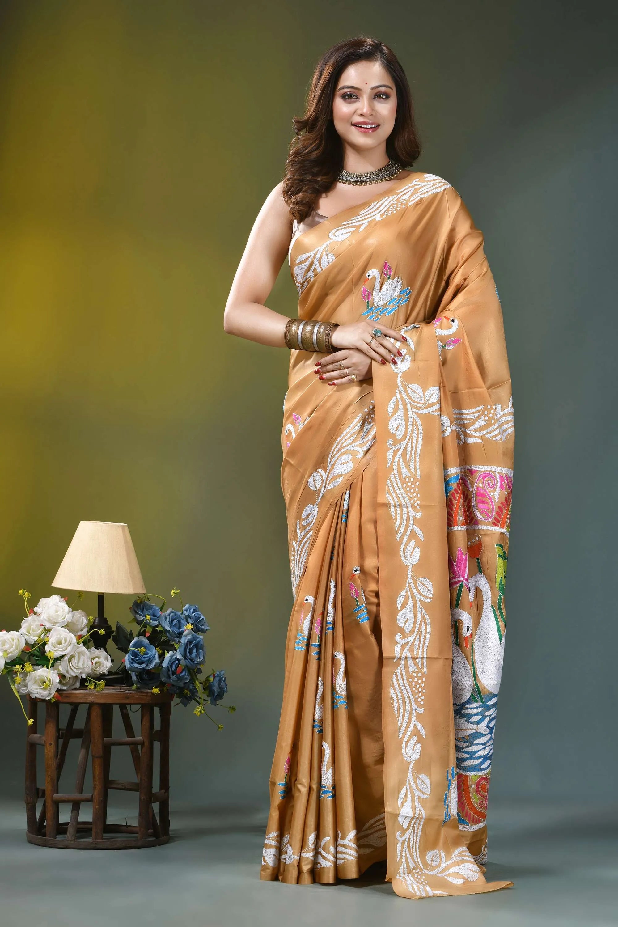Camel gold multicolor swan design silk kantha saree woman wears golden-orange silk saree 1