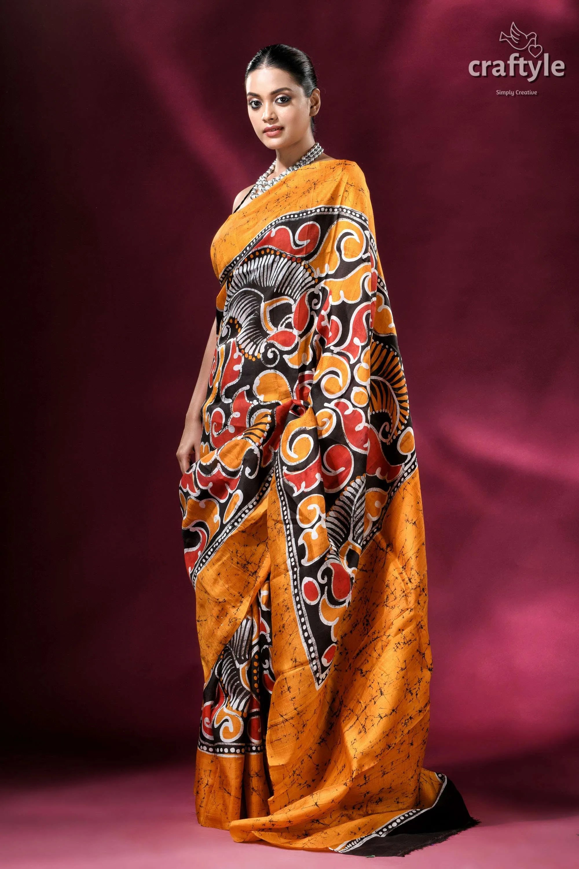 Carrot orange and black hand-painted wax batik pure mulberry silk saree vibrant orange saree bold black 5