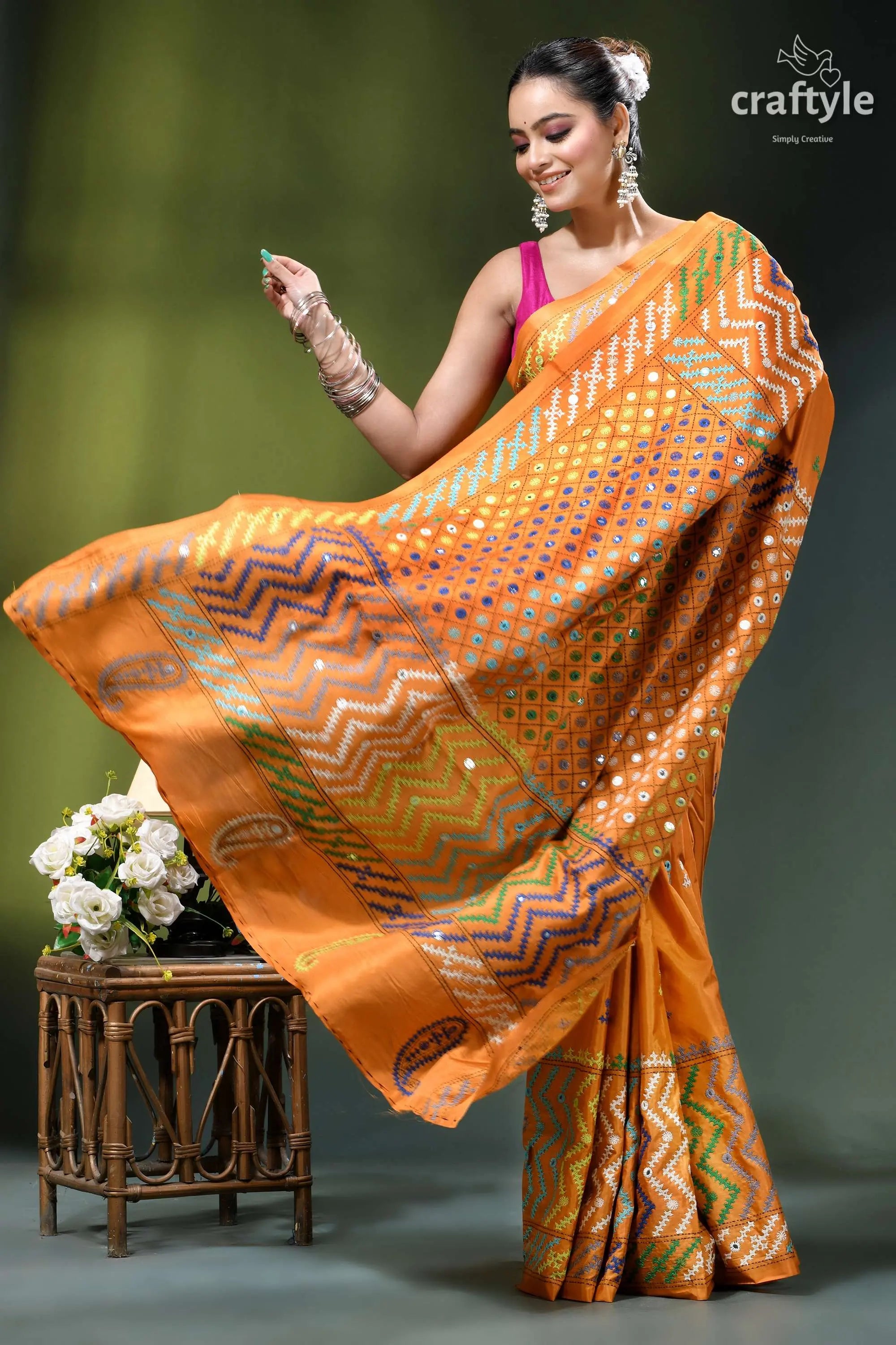 Carrot orange intricate gujrati stitched silk saree with mirror work orange silk saree intricate geometric 5