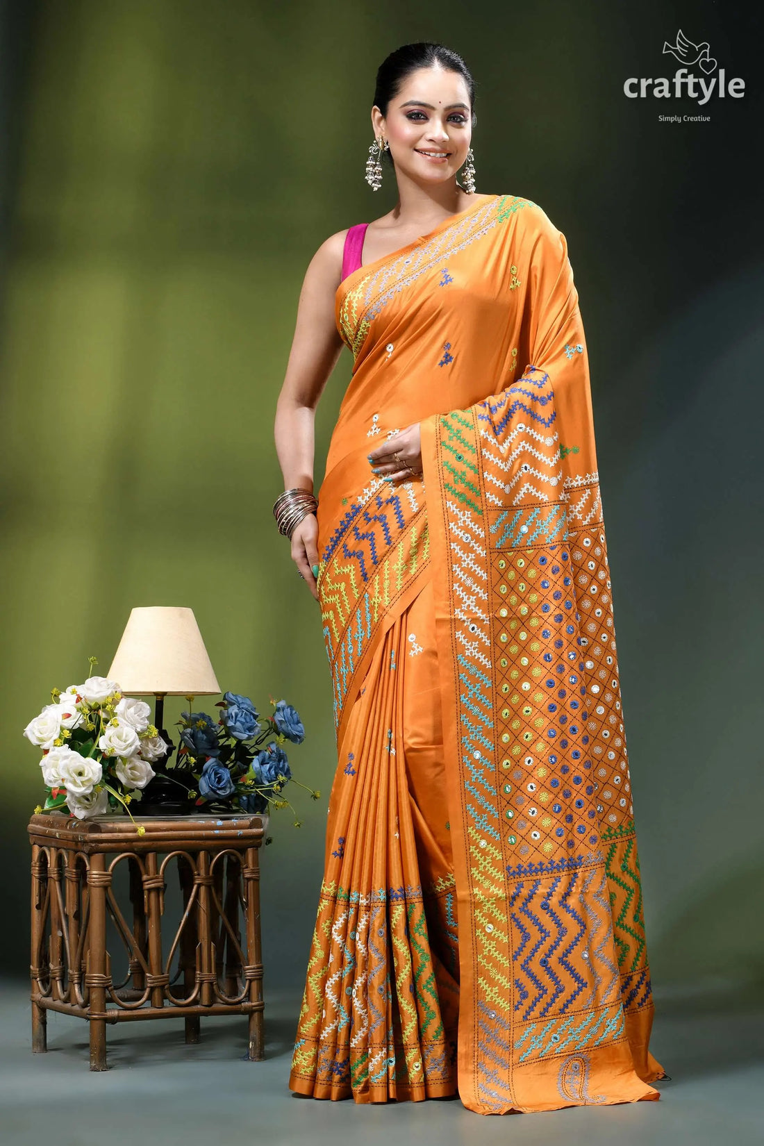 Carrot orange intricate gujrati stitched silk saree with mirror work vibrant orange saree intricate geometric 1
