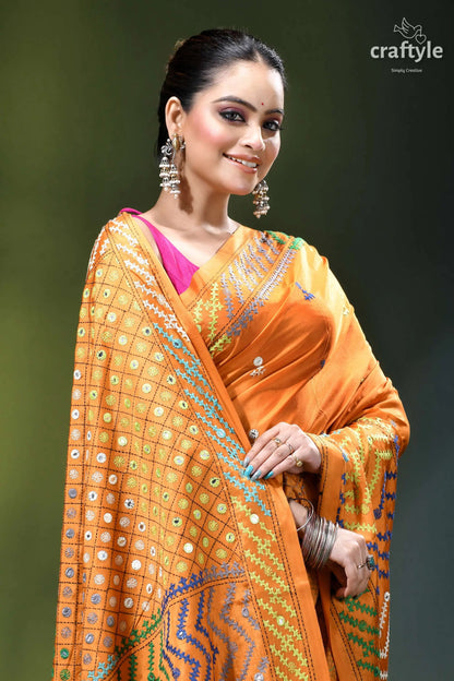 Carrot orange intricate gujrati stitched silk saree with mirror work vibrant orange saree intricate geometric 2