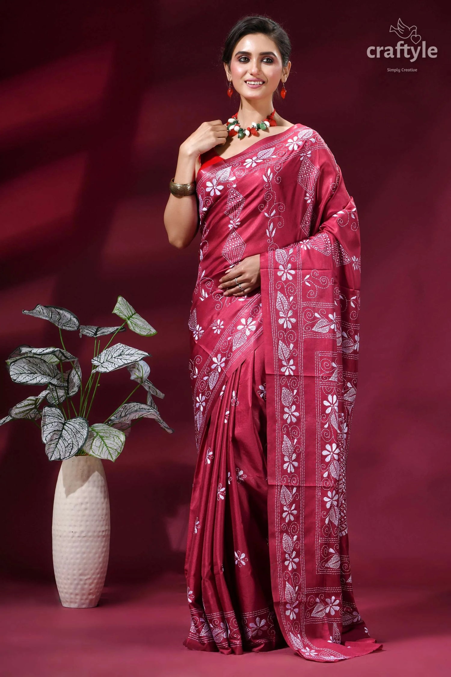 Cerise pink fish motif handcrafted silk kantha stitch saree woman wears vibrant pink saree 6