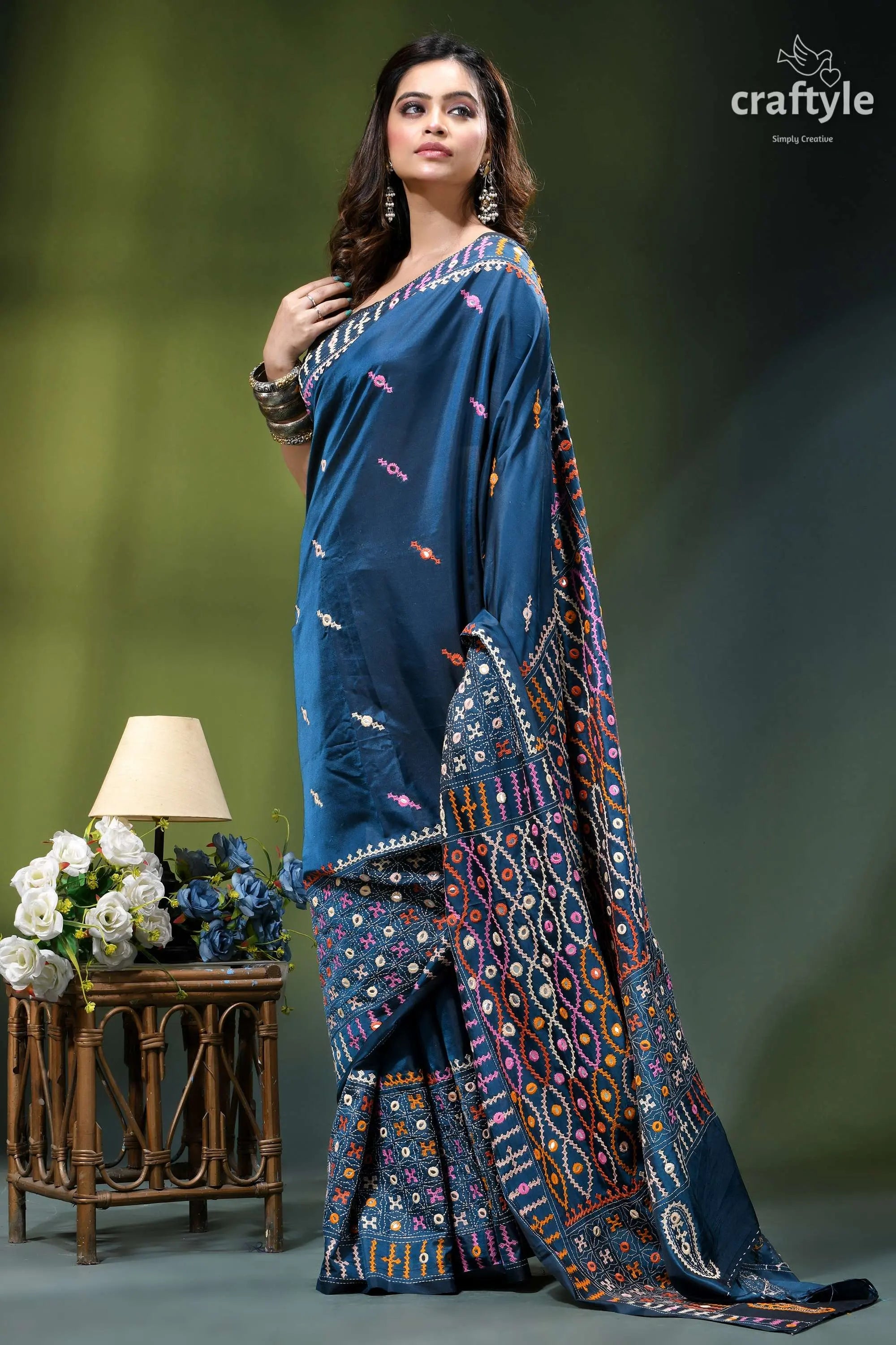 Cerulean blue hand kutch embroidery silk saree with mirror work woman wears deep blue embroidered 4