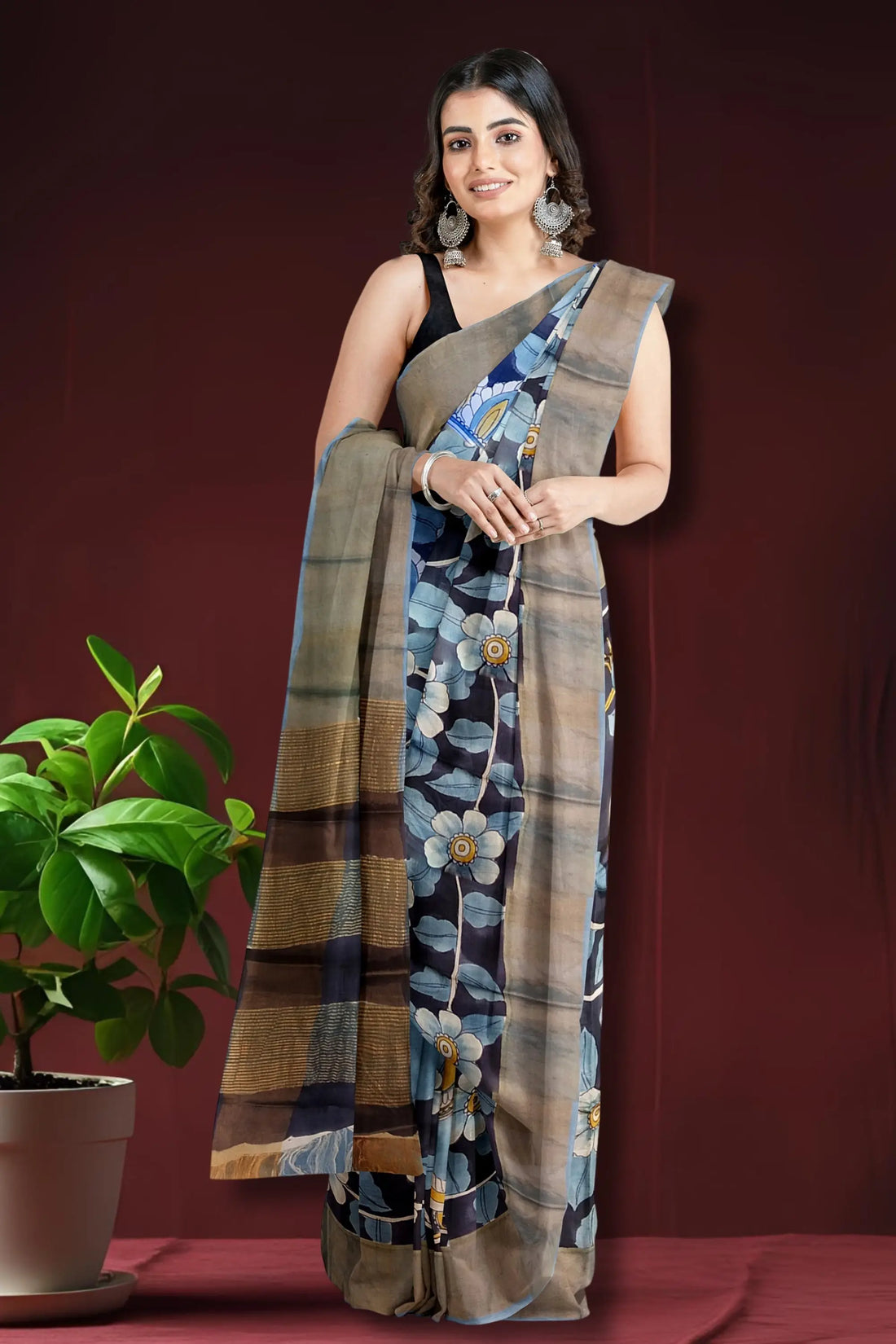 Charcoal black hand-painted pure tussar kalamkari saree with zari border woman floral-patterned saree 1