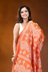 Circular motif hand embroidered silk kutch work saree in orange vibrant orange saree intricate white 2
