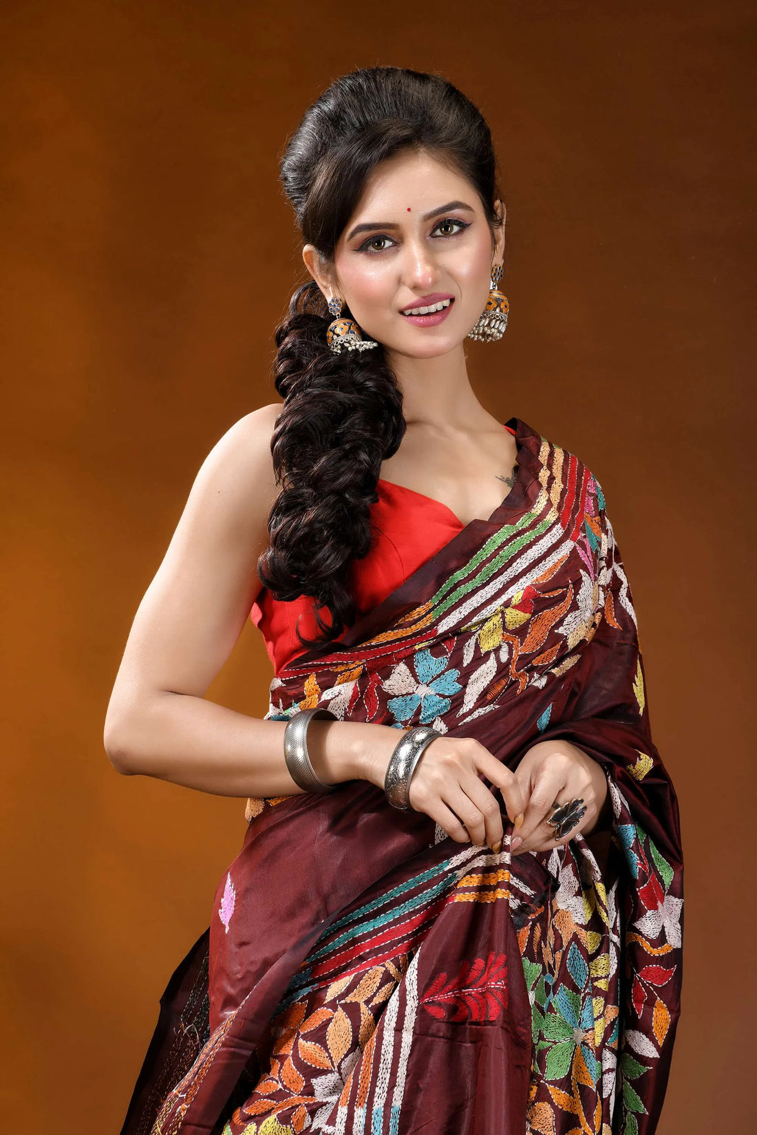 Cocoa bean hand embroidered silk kantha stitch saree - multicolor floral motif woman wears maroon silk saree 2