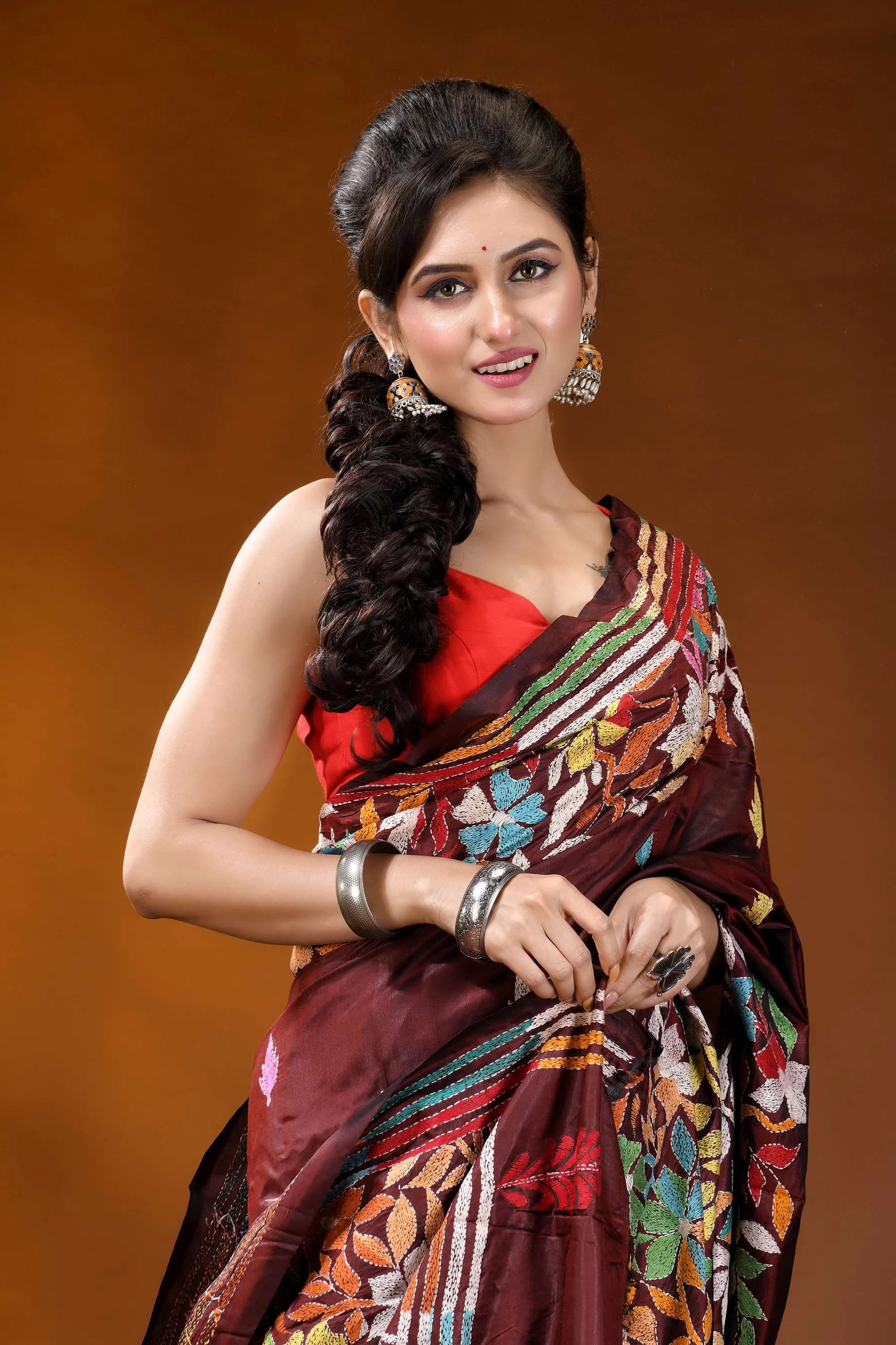 Cocoa bean hand embroidered silk kantha stitch saree - multicolor floral motif woman wears maroon silk saree 2