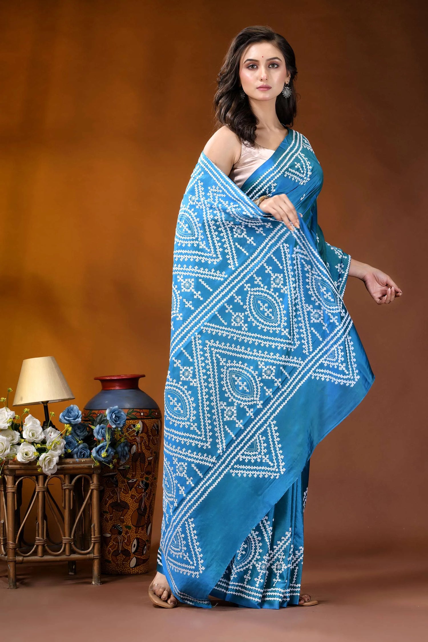 Curious blue ethnic motif handcrafted gujrati stitch silk saree woman wears vibrant blue saree 4