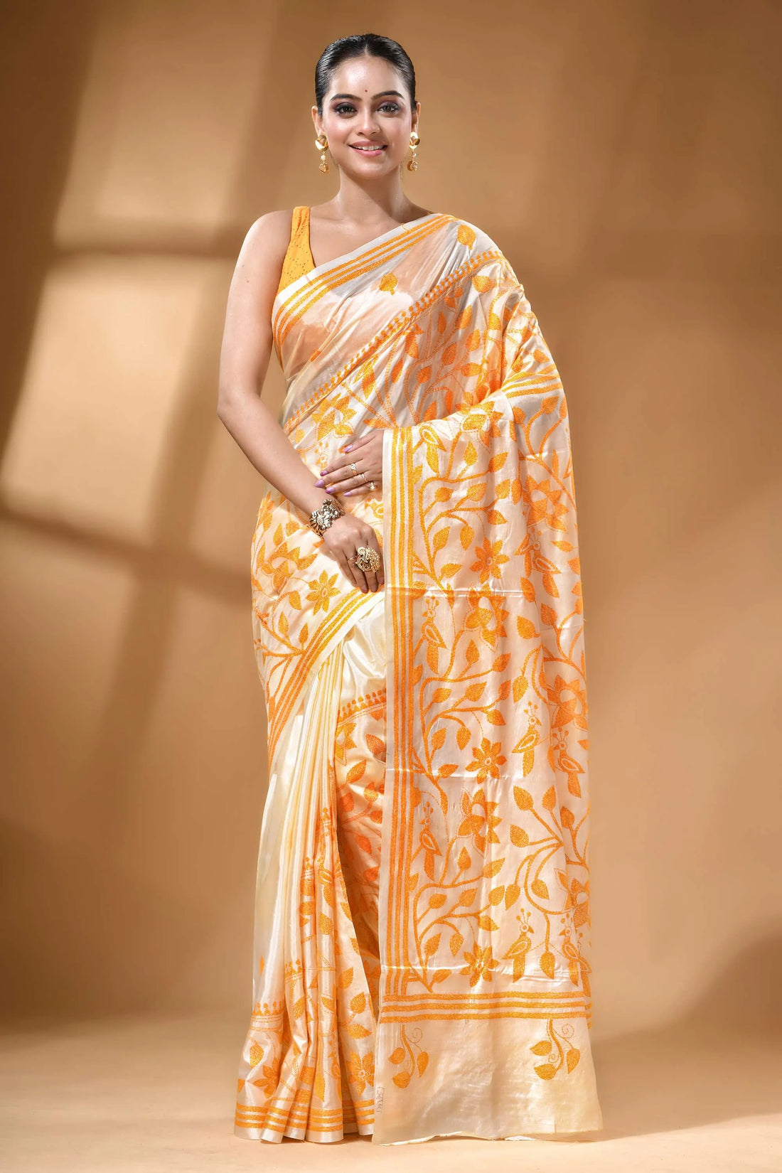 Daisy white orange thread floral silk kantha stitch saree woman wears cream orange floral-patterned 1