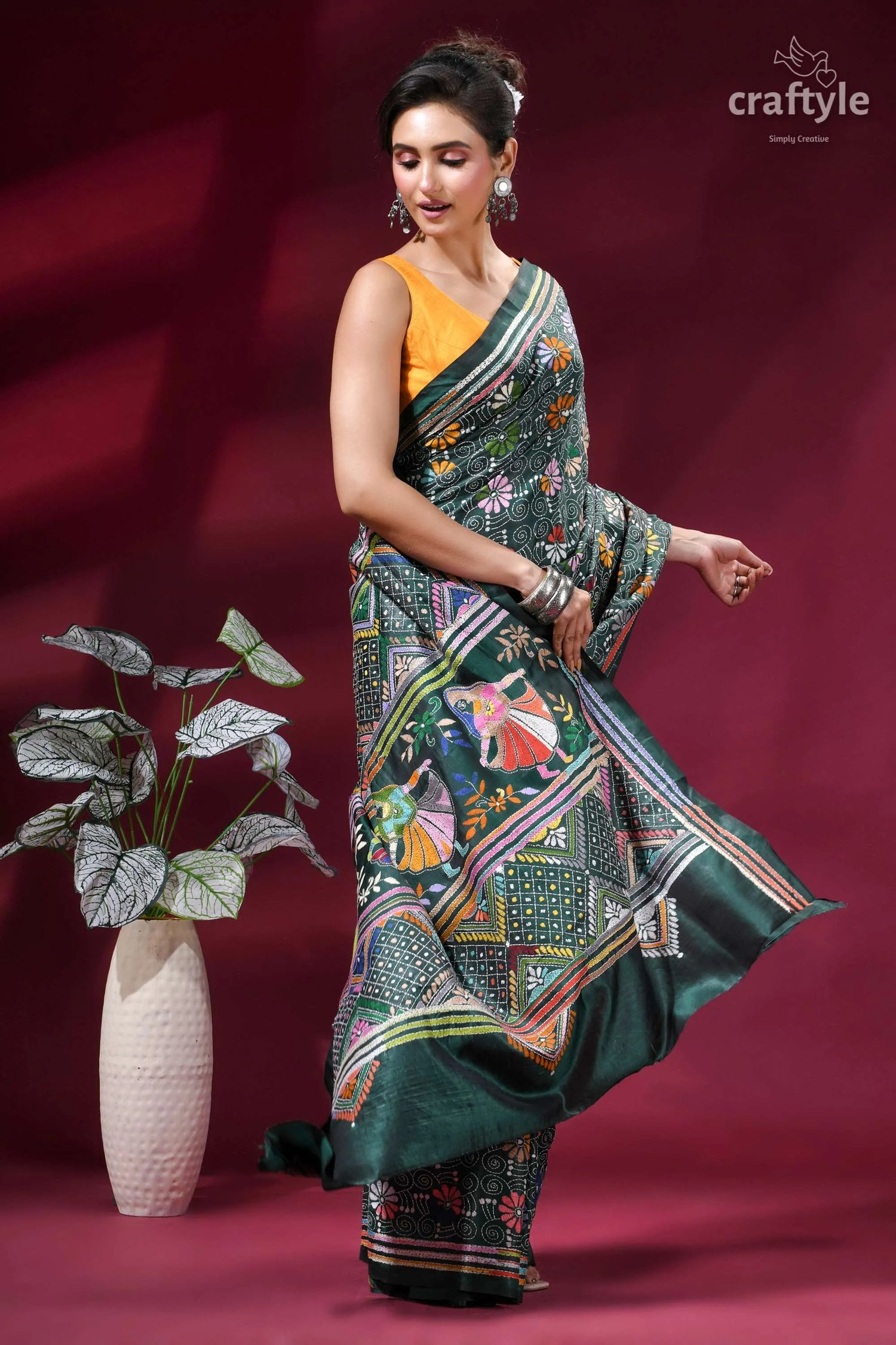 Dark green folk art design kantha stitched silk saree woman wears vibrant green silk 4