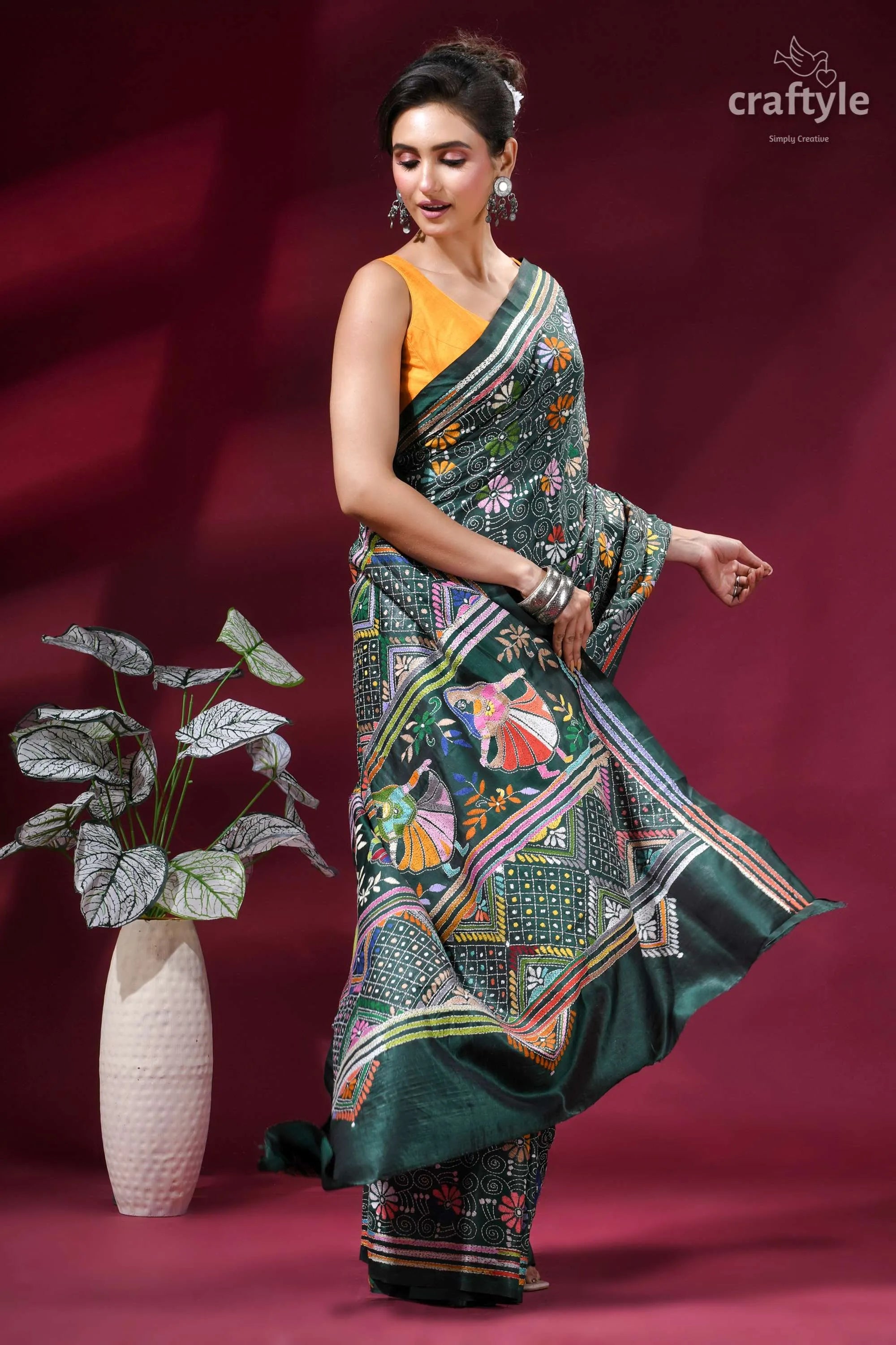 Dark green folk art design kantha stitched silk saree woman wears vibrant green silk 4