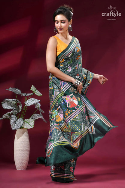 Dark green folk art design kantha stitched silk saree woman wears vibrant green silk 4