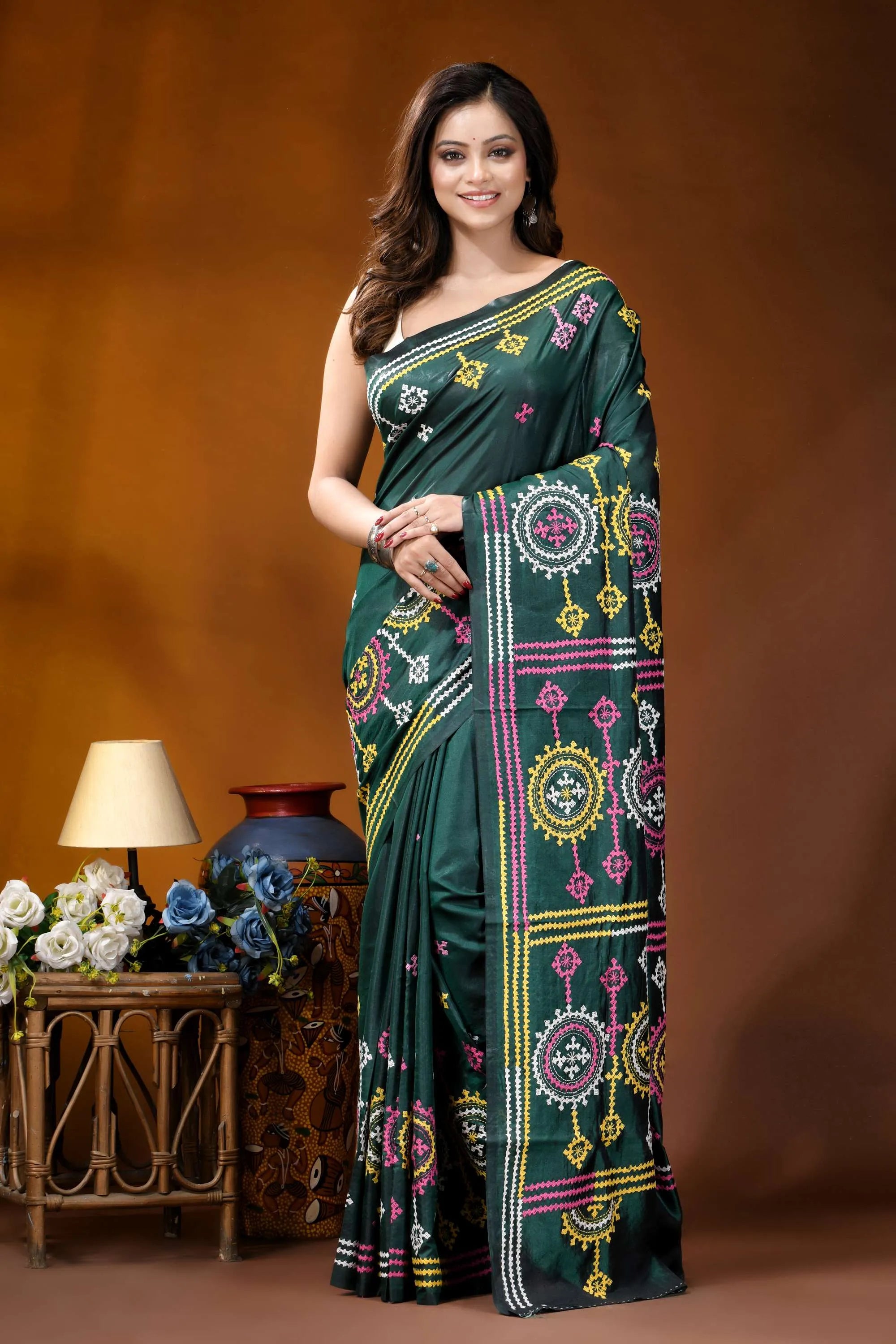 Dark green multicolor floral motif handcrafted gujrati stitch silk saree dark green silk saree adorned 1
