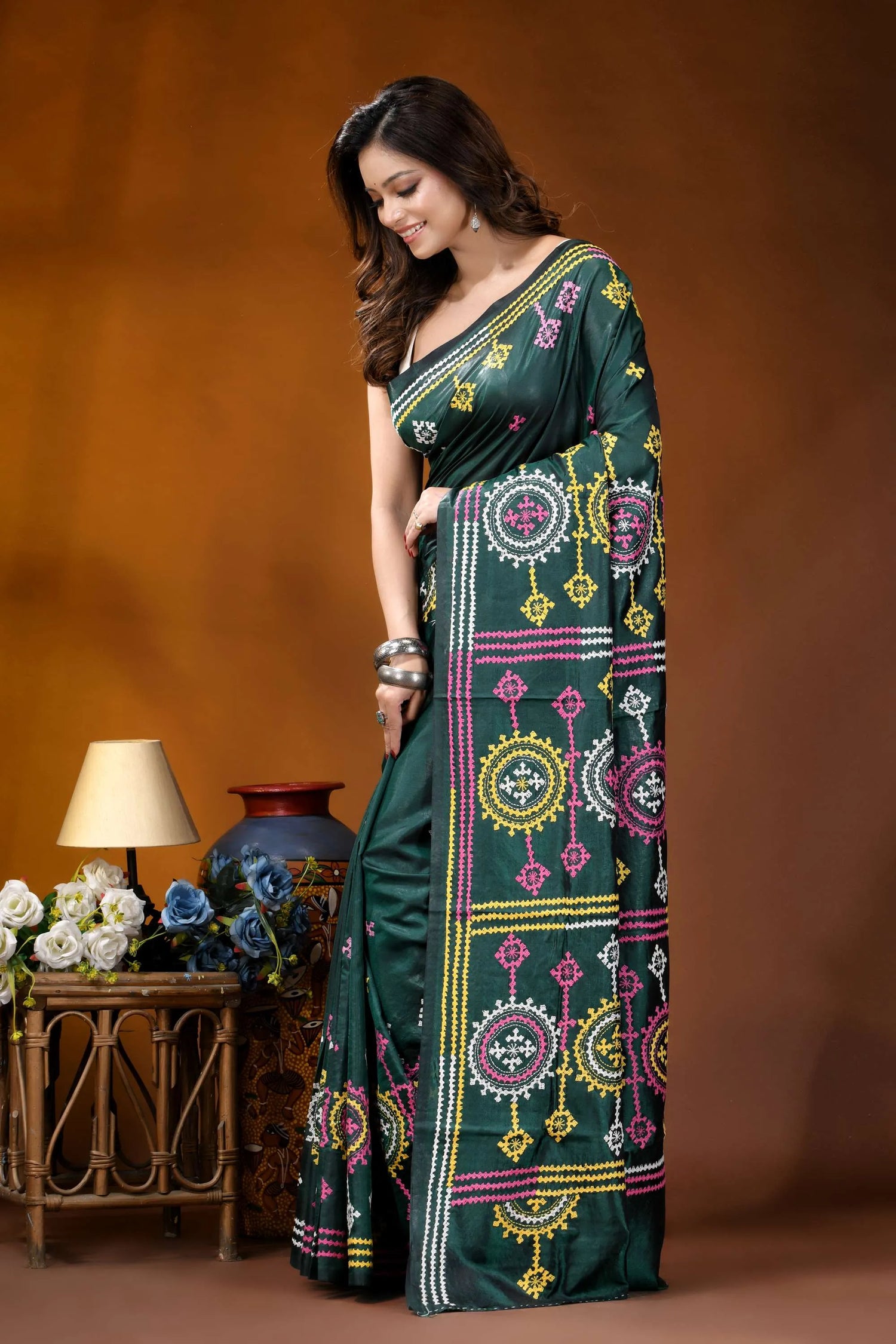 Dark green multicolor floral motif handcrafted gujrati stitch silk saree dark green saree adorned intricate 3