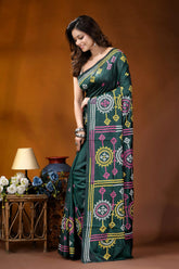 Dark green multicolor floral motif handcrafted gujrati stitch silk saree dark green saree adorned intricate 3