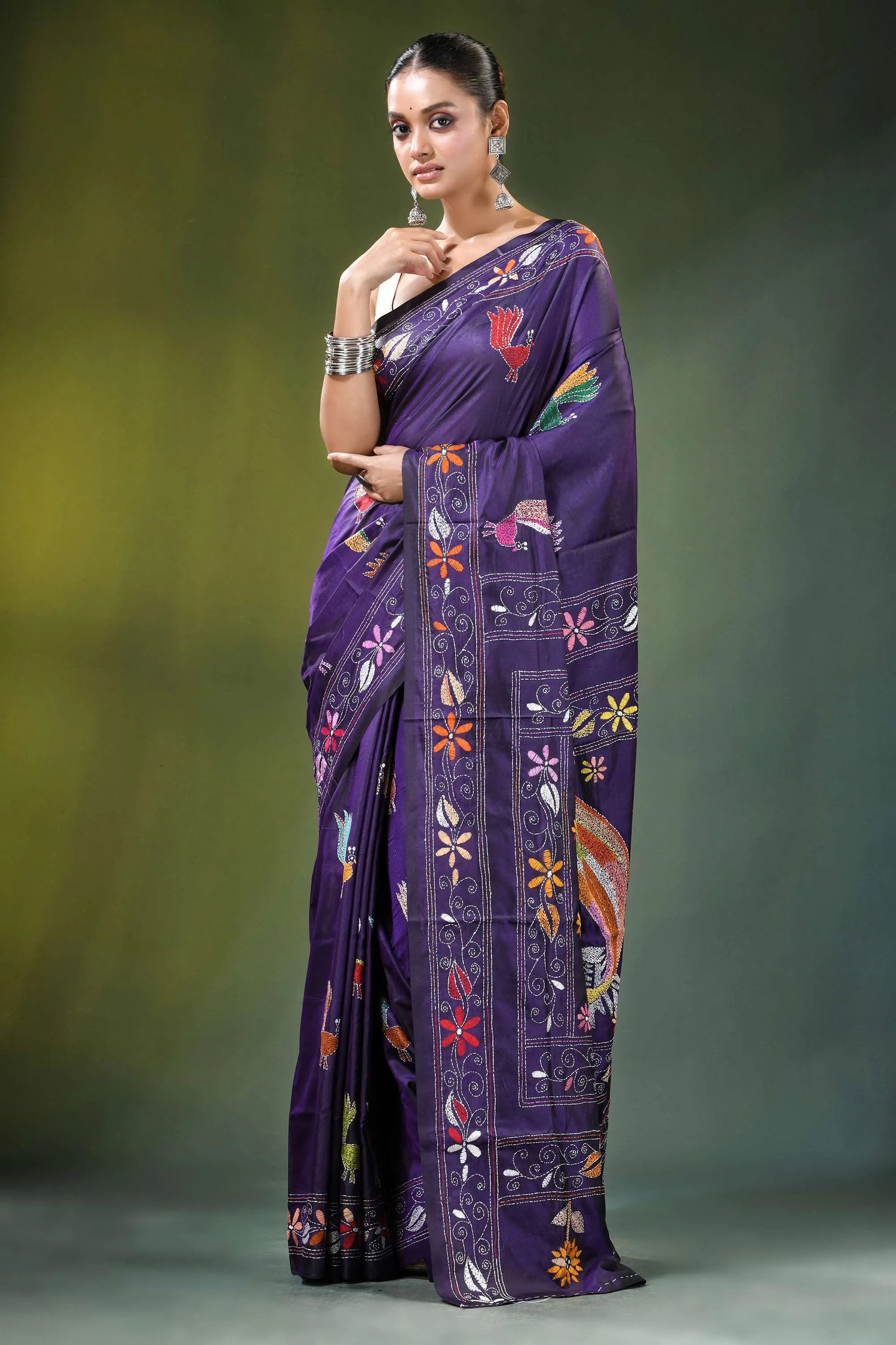 Dark purple peacock motif handcrafted silk kantha stitch saree vibrant adorned intricate 1