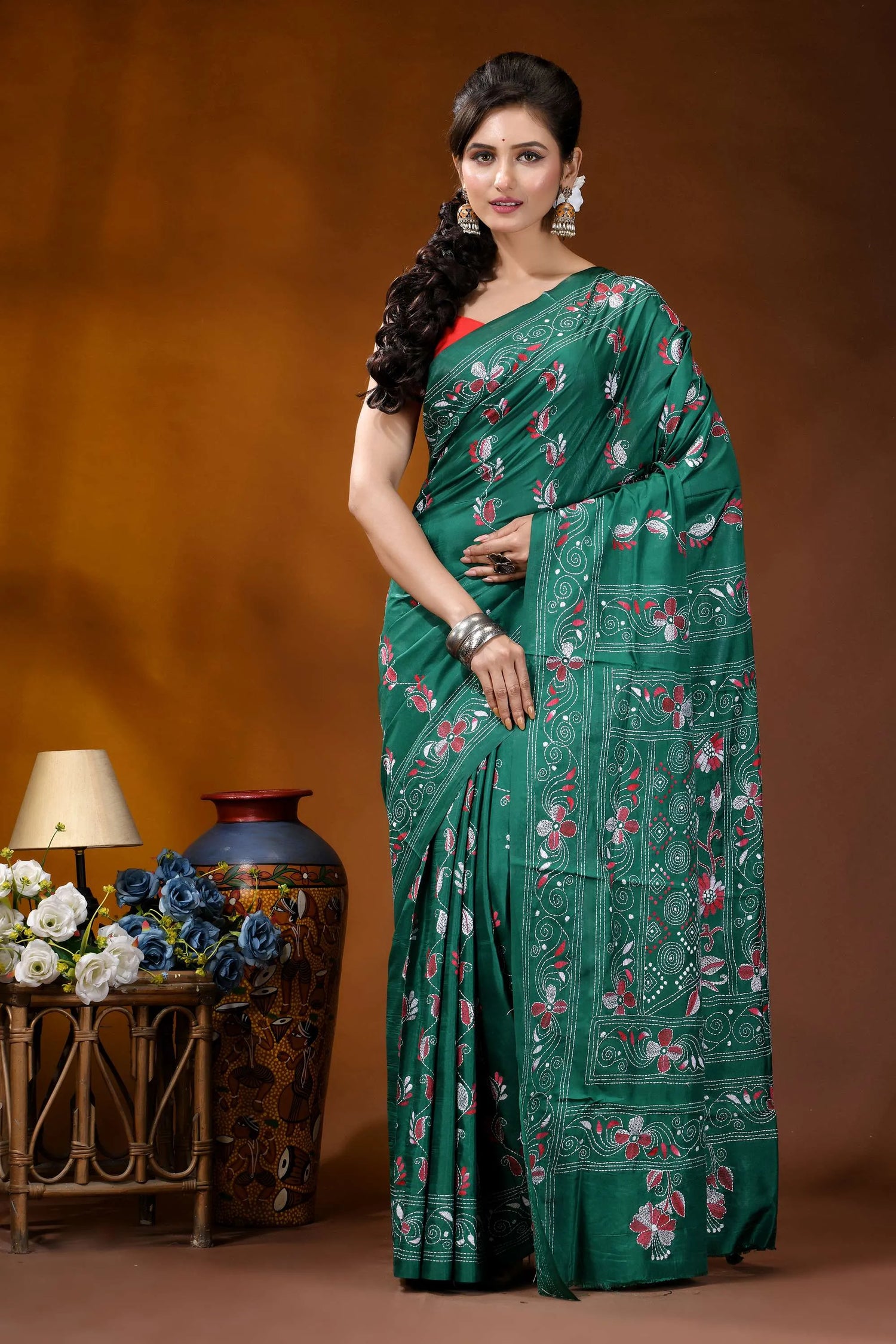 Deep sea green silk kantha stitch saree - hand embroidered floral design woman wears vibrant emerald green 1