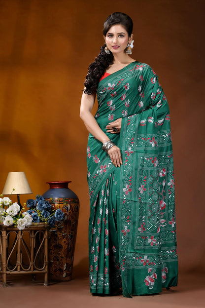 Deep sea green silk kantha stitch saree - hand embroidered floral design woman wears vibrant emerald green 1