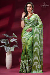 Drab green intricate gujrati stitch silk saree with mirror work vibrant green silk saree adorned 1