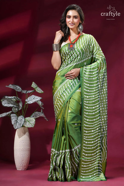 Drab green intricate gujrati stitch silk saree with mirror work vibrant green silk saree adorned 1