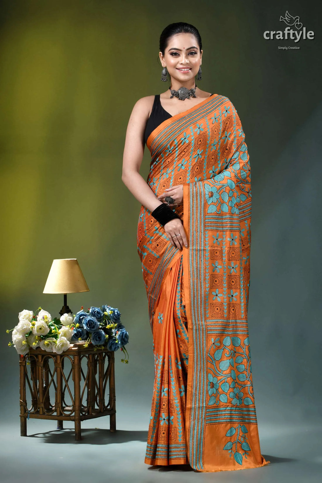 Dull orange floral pattern hand embroidered silk kantha saree orange teal patterned silk saree 1