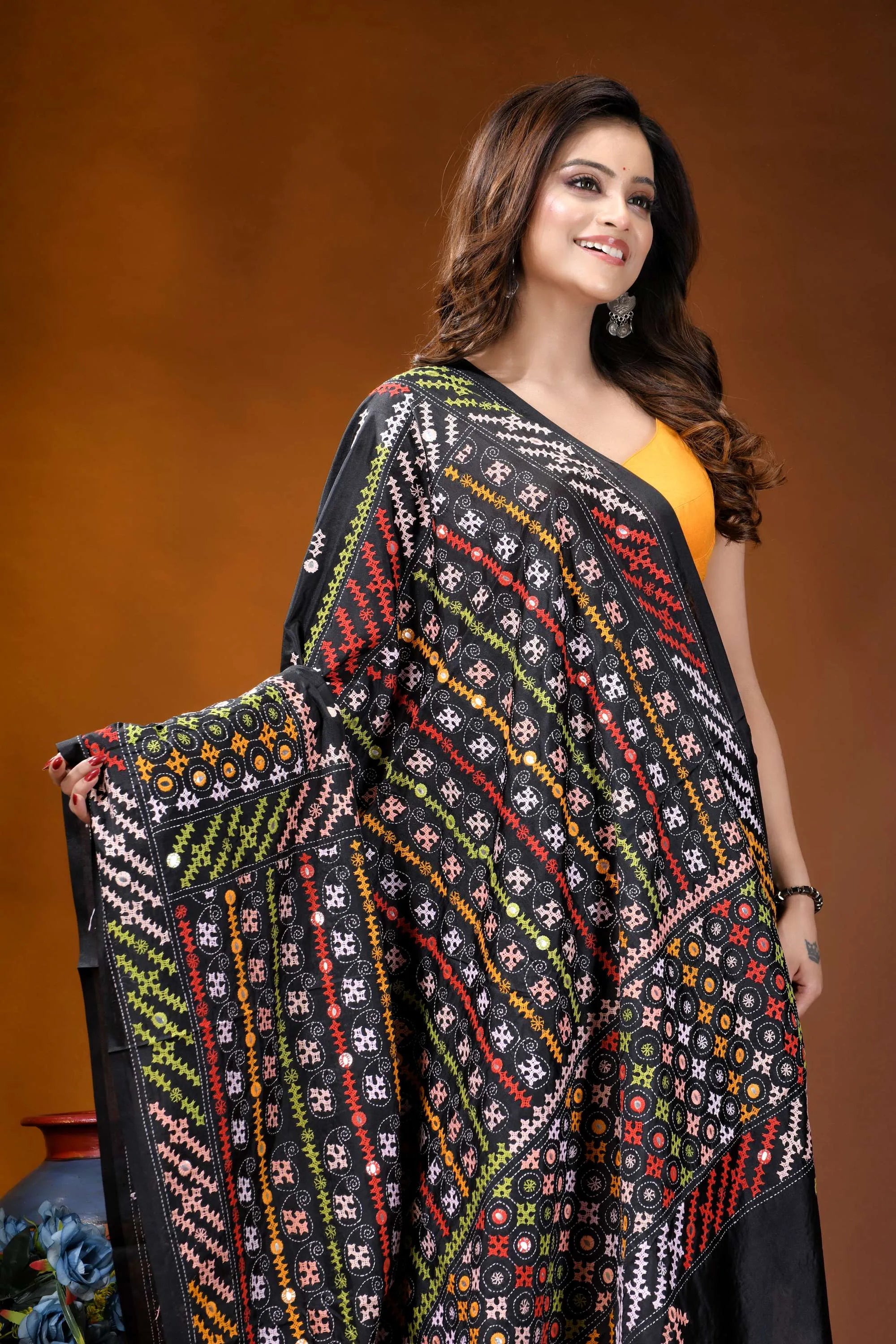 Ebony black multicolor hand-stitched kutch work silk saree with mirror detailing black embroidered saree vibrant