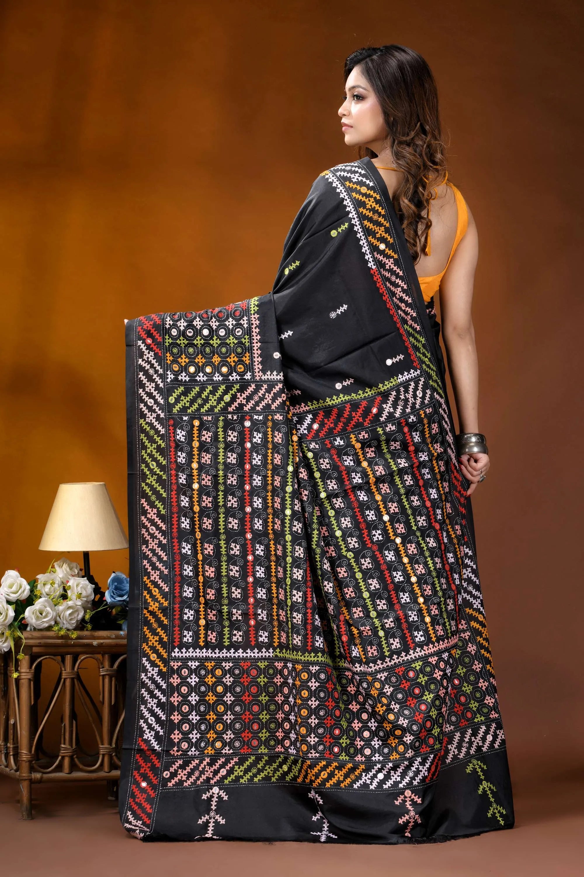 Ebony black multicolor hand-stitched kutch work silk saree with mirror detailing black saree intricate multicolored