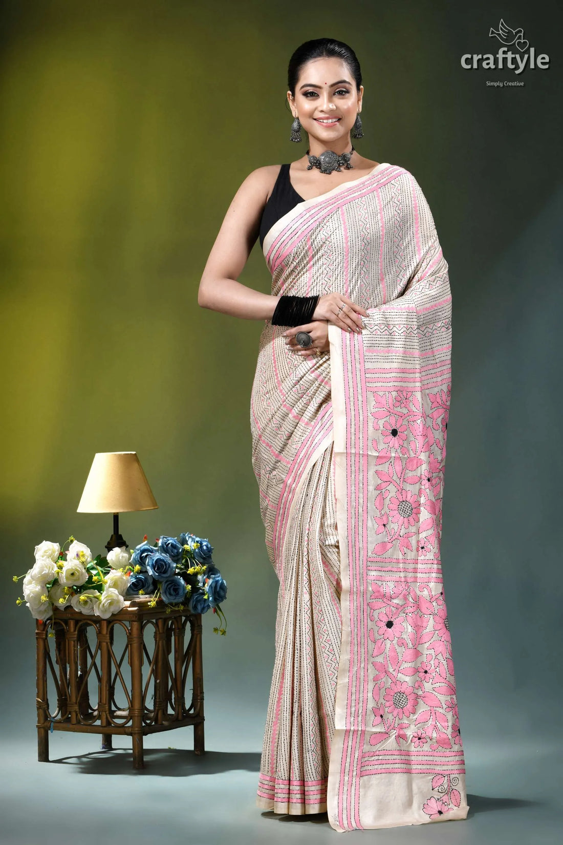 Eggshell white geometric-floral heritage silk kantha stitch saree woman wears beige pink silk 1