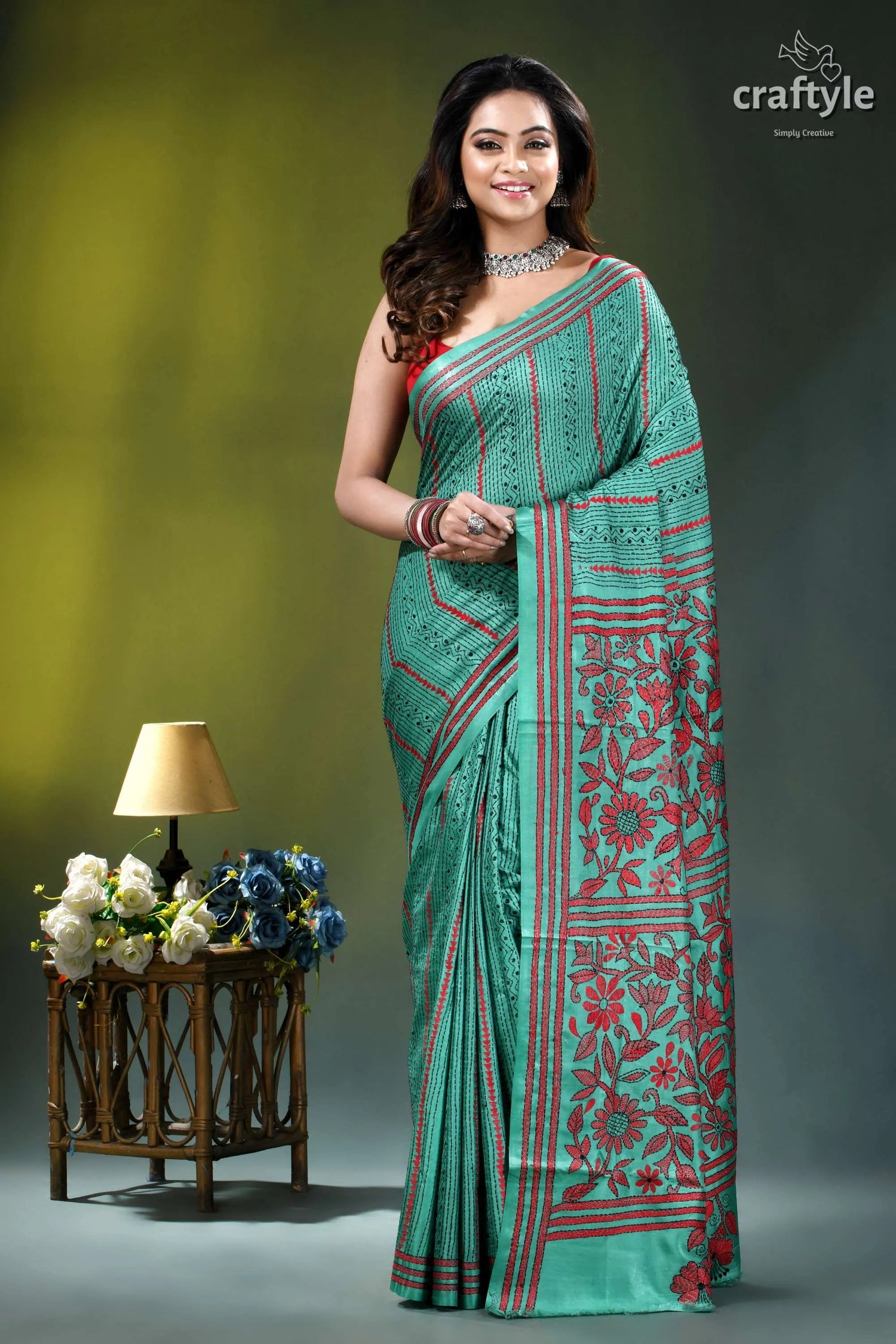 Floral motif silk kantha embroidery saree in light sea green woman wears teal red floral-patterned 1