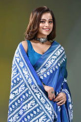 Fun blue handcrafted floral motif silk kantha stitch saree woman wears vibrant blue saree 2