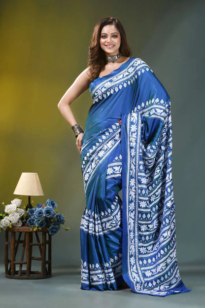 Fun blue handcrafted floral motif silk kantha stitch saree woman wears vibrant blue saree 6