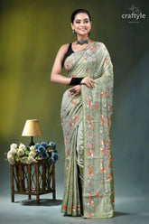 Grayish olive floral motif handmade silk kantha stitch saree woman wears light green silk 6