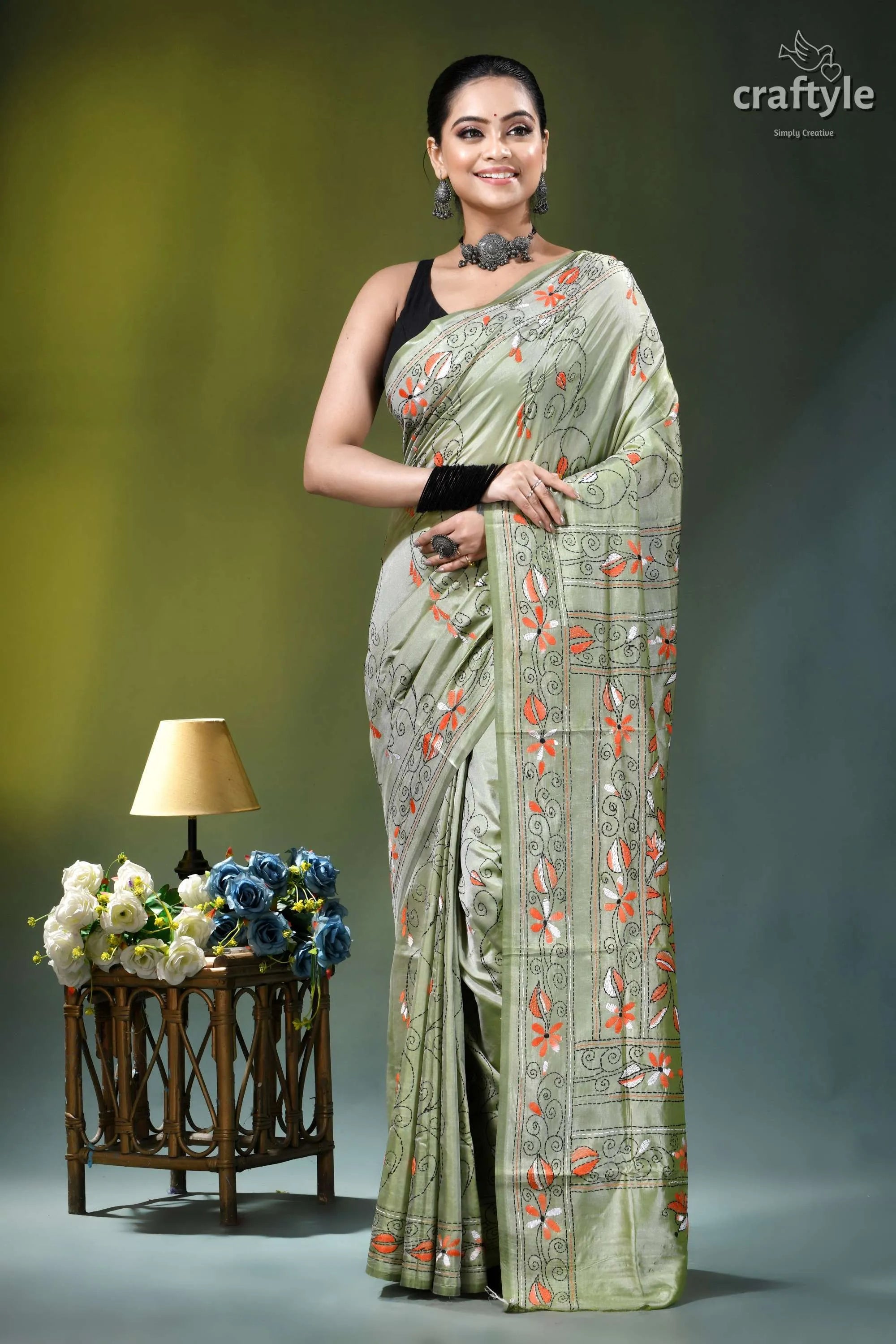 Grayish olive floral motif handmade silk kantha stitch saree woman wears light green silk 6