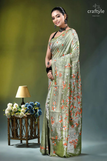 Grayish olive floral motif handmade silk kantha stitch saree woman wears light green silk 3