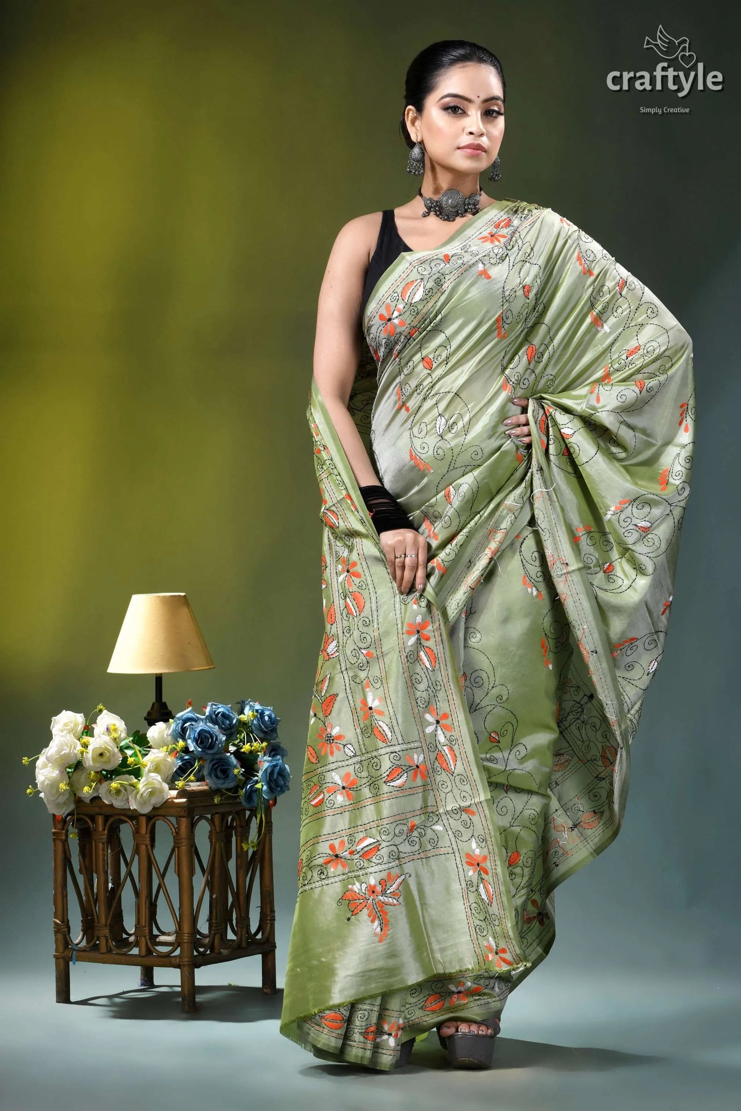 Grayish olive floral motif handmade silk kantha stitch saree woman wears light green silk 4
