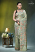 Grayish olive floral motif handmade silk kantha stitch saree woman wears light green silk 1