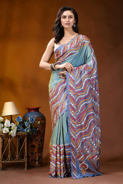 Greyish teal multi-thread ethnic design gujarati stitch dyed silk saree - mirror detailing woman wears light blue saree