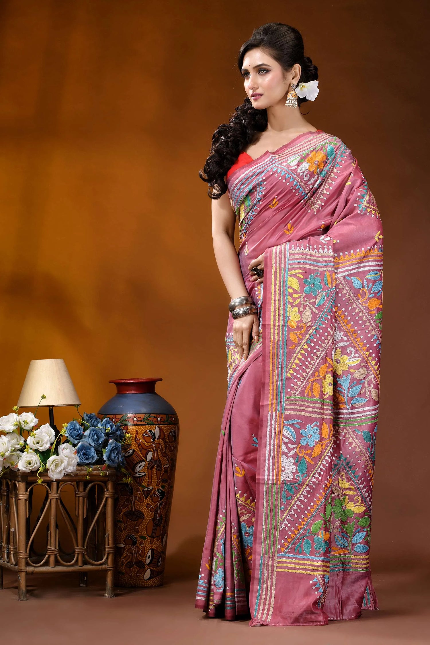 Hand embroidered floral motif silk kantha stitch saree in tulip pink woman wears vibrant pink saree 3
