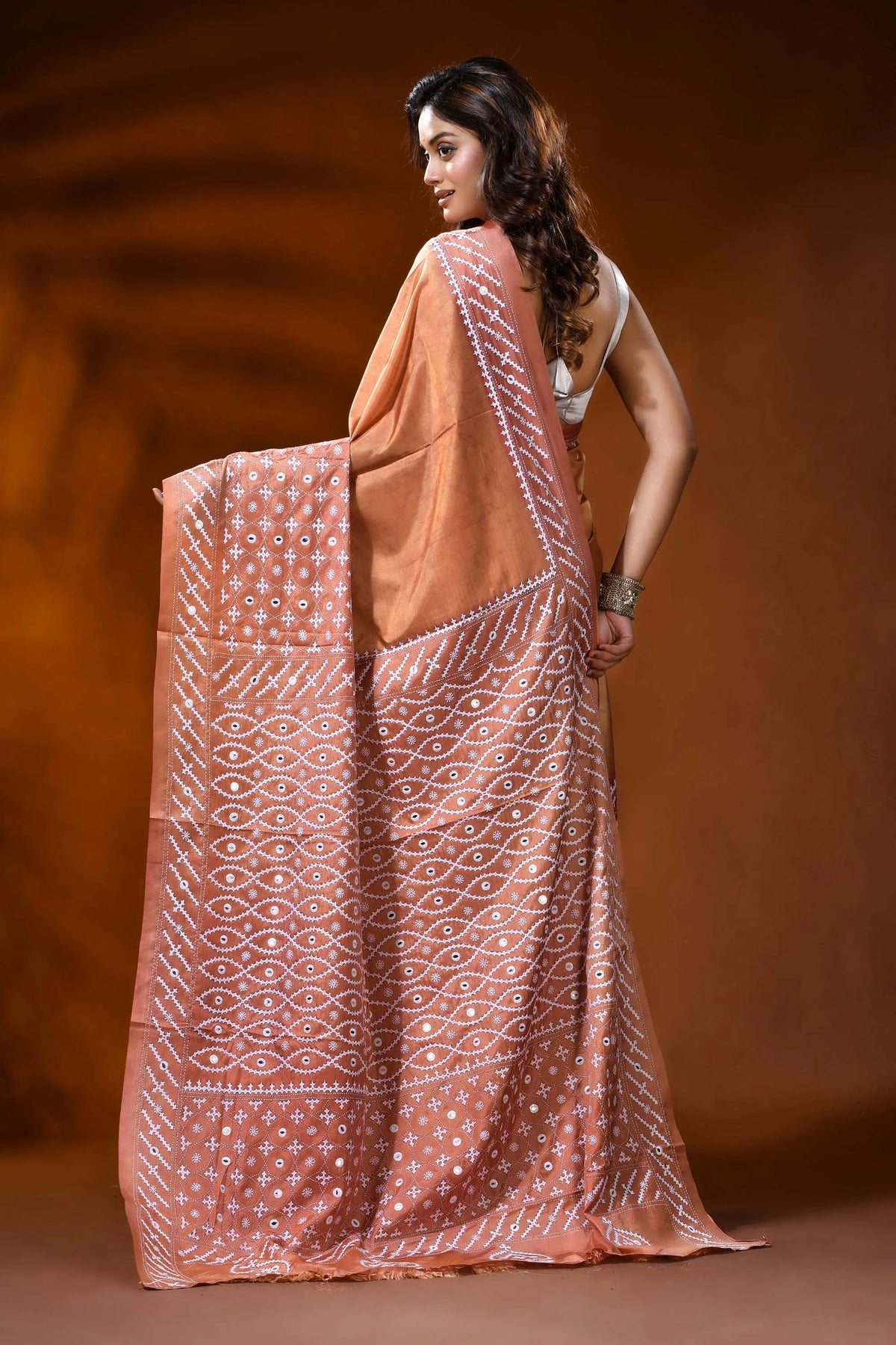 Hand embroidered peach kutch work silk saree with mirror detailing 5