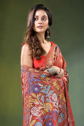 Hand embroidered rust brown floral motif silk kantha saree woman wears vibrant red sari 2