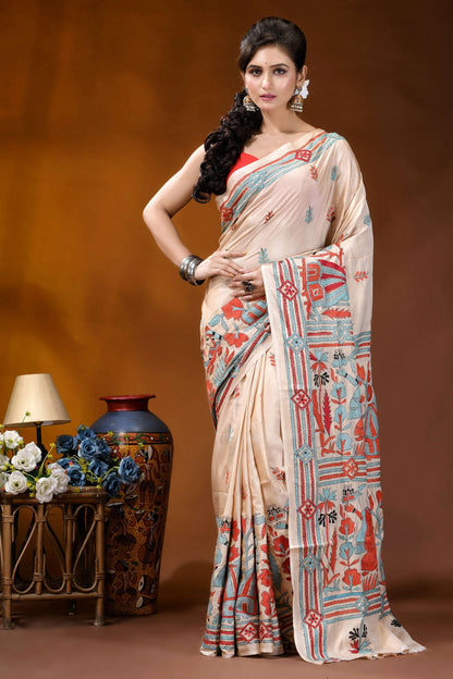 Hand embroidered village theme silk kantha stitch saree in beige woman wears beige saree intricate 1