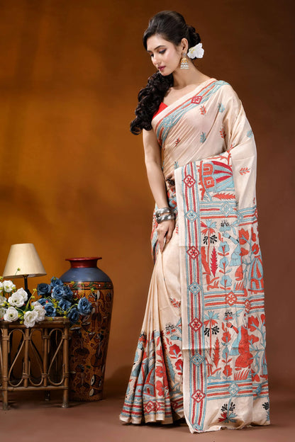 Hand embroidered village theme silk kantha stitch saree in beige woman wears beige saree intricate 3