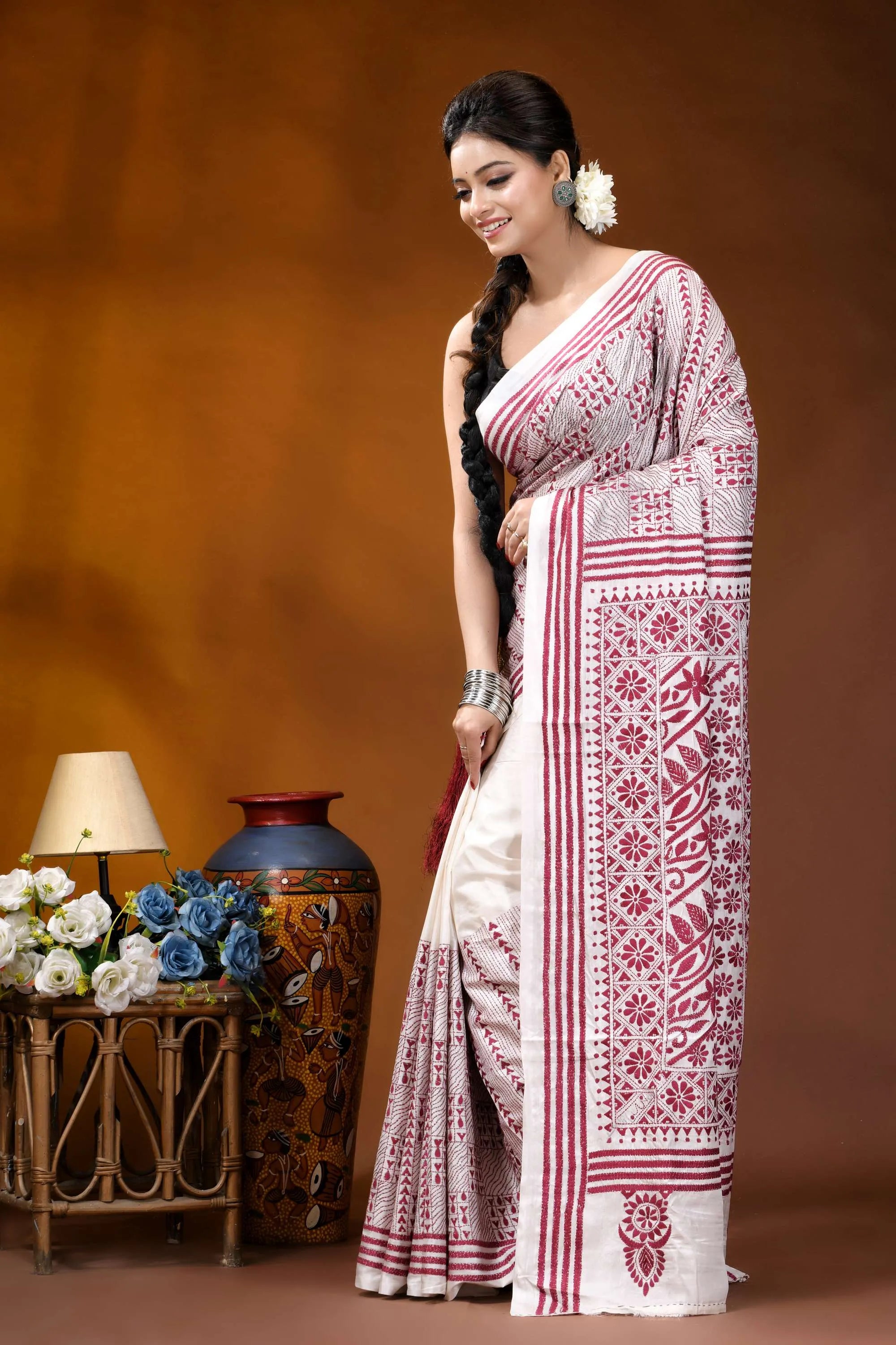 Hand embroidered white maroon floral design kantha silk saree woman wears white maroon patterned 3