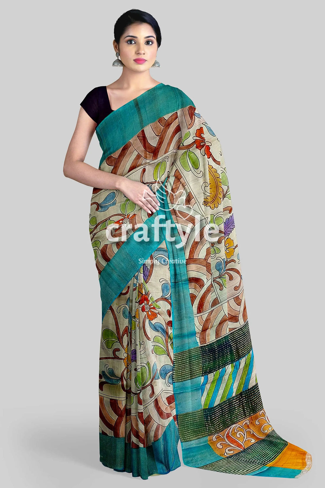Hand painted pure tussar kalamkari saree with zari border - artisan crafted woman floral-patterned saree teal border 1
