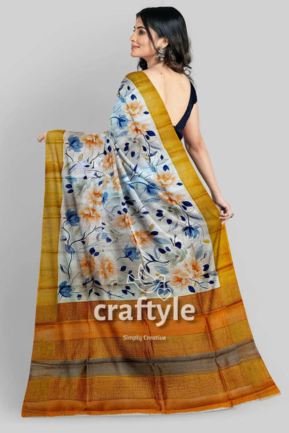 Hand painted white floral pure tussar silk saree with zari detail floral-patterned saree golden border 5