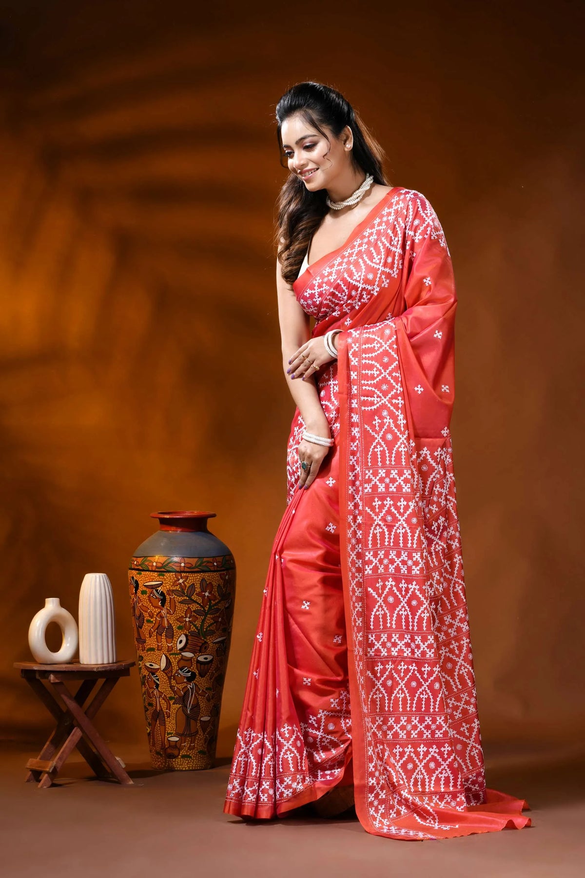 Handcrafted coral red silk kutch work saree with ethnic motifs 3